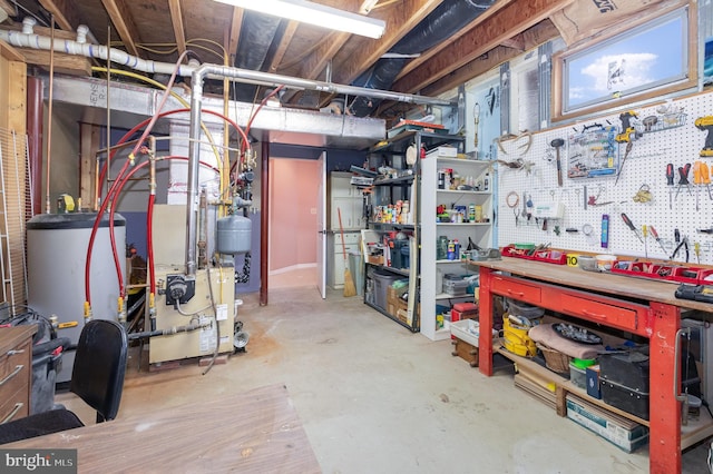 basement featuring a workshop area and gas water heater