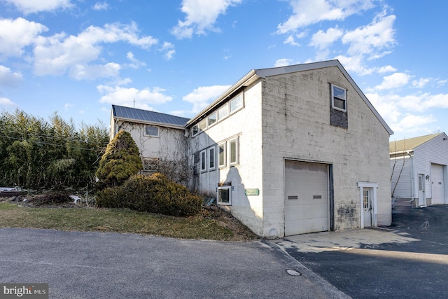 view of home's exterior with a garage