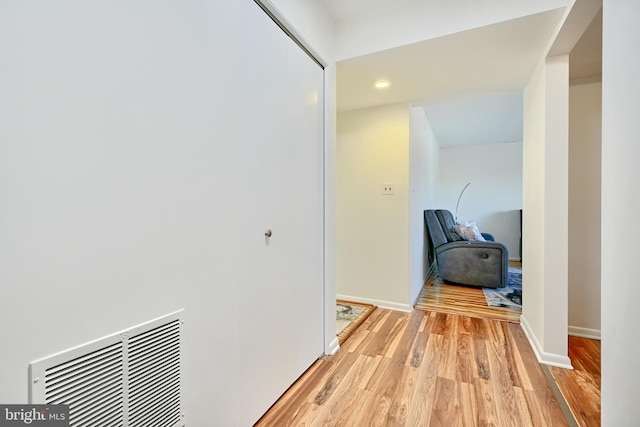 corridor featuring light hardwood / wood-style floors