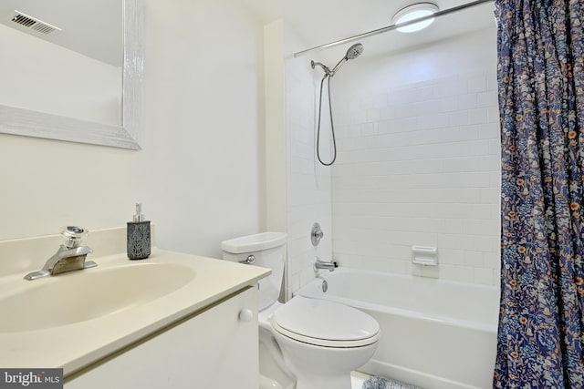 full bathroom featuring shower / tub combo with curtain, vanity, and toilet