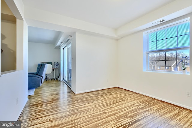 unfurnished room featuring light wood-type flooring