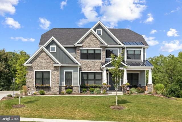 craftsman inspired home with a front lawn