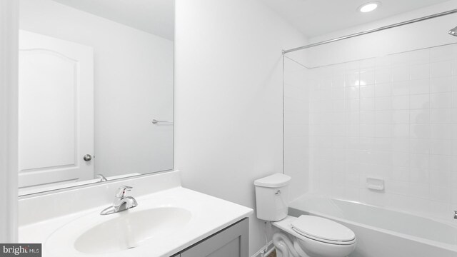 full bathroom featuring shower / bathing tub combination, vanity, and toilet