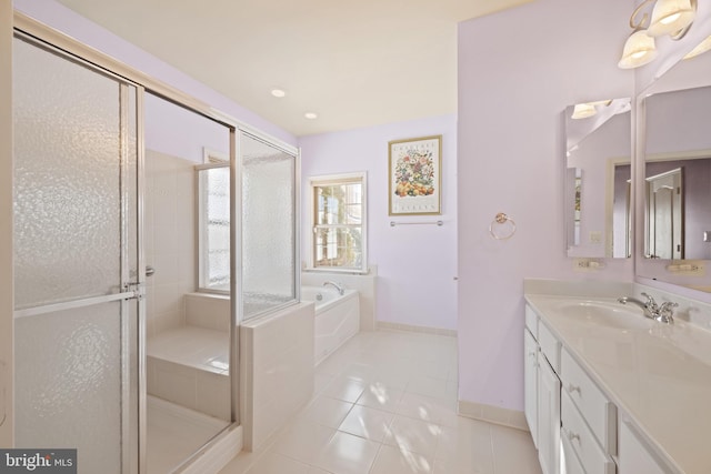 bathroom with shower with separate bathtub, vanity, and tile patterned floors