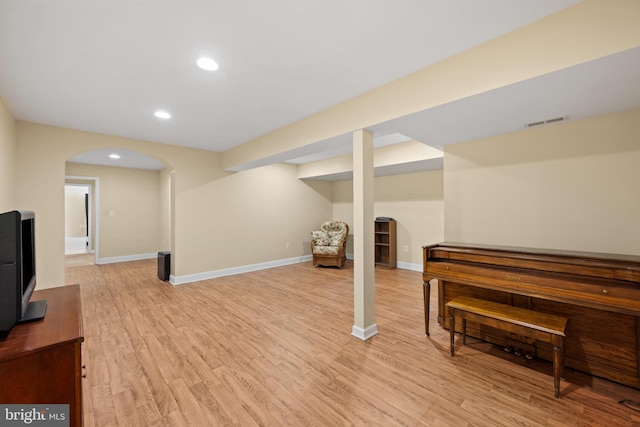 basement featuring light hardwood / wood-style flooring