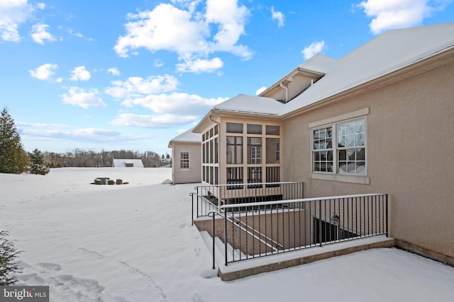 view of snow covered deck