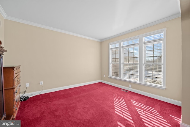 empty room featuring carpet and ornamental molding