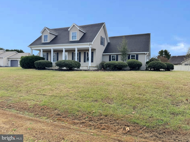 new england style home with a front lawn and a porch