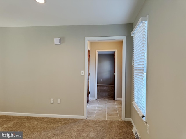 corridor with light carpet