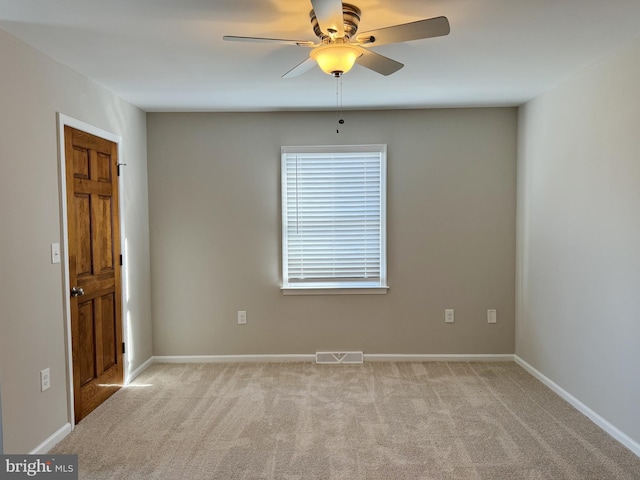 carpeted empty room with ceiling fan