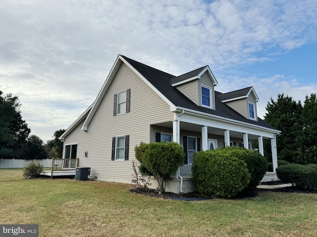 view of property exterior featuring a lawn and central air condition unit