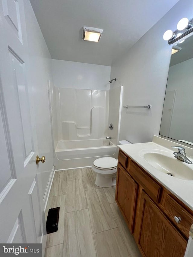 full bathroom featuring vanity, toilet, and tub / shower combination