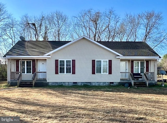 view of front of home featuring covered porch and a front lawn