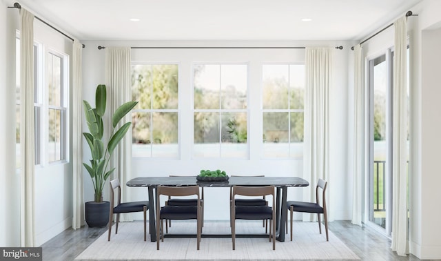 sunroom / solarium featuring a healthy amount of sunlight