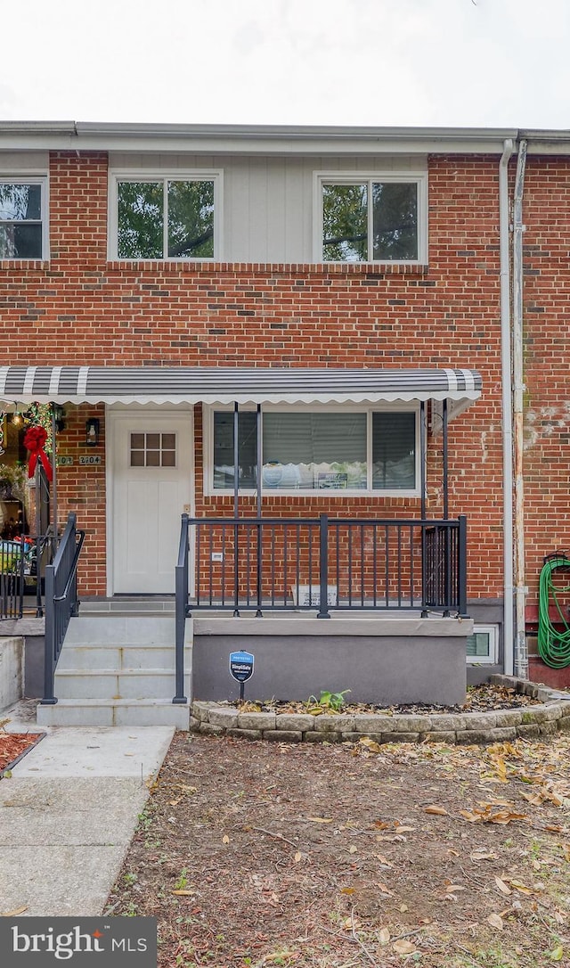 view of property featuring covered porch