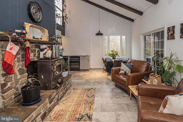 interior space with beam ceiling, high vaulted ceiling, and beverage cooler