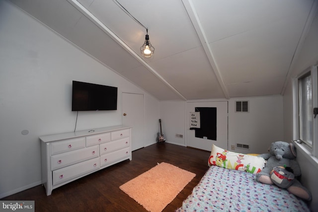 bedroom with vaulted ceiling and dark wood-type flooring