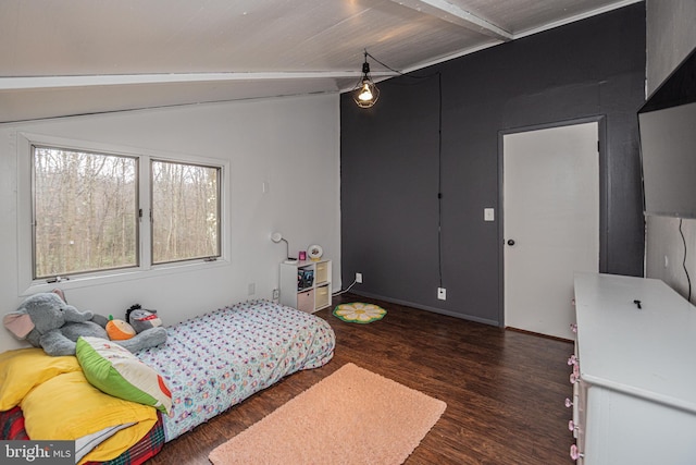 bedroom featuring vaulted ceiling with beams and dark hardwood / wood-style floors