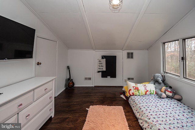 bedroom with vaulted ceiling and dark hardwood / wood-style floors