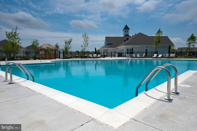 view of swimming pool with a patio area