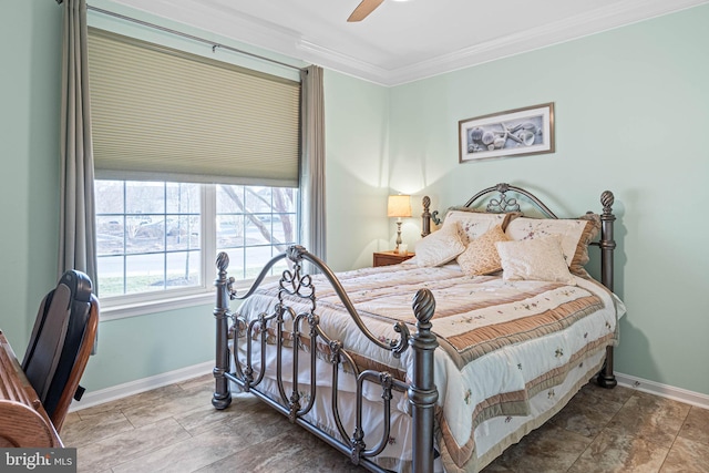 bedroom with ceiling fan and crown molding