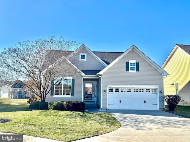 view of front of home featuring a garage and a front lawn