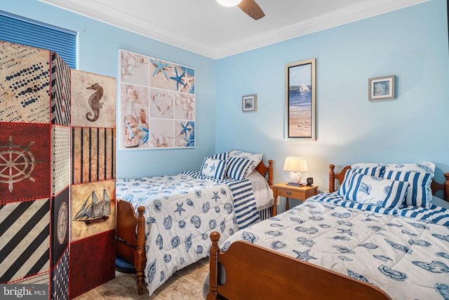 bedroom with ceiling fan and crown molding