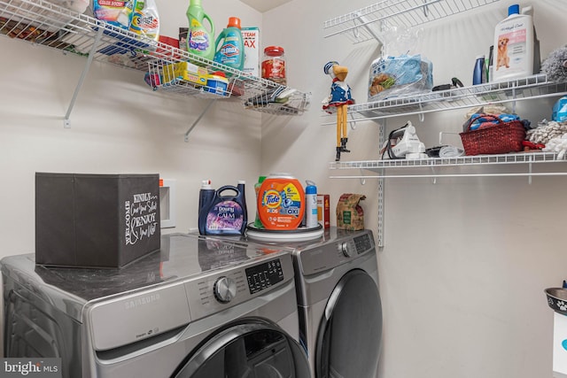 washroom with washer and clothes dryer