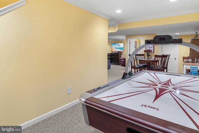 recreation room with carpet flooring and crown molding