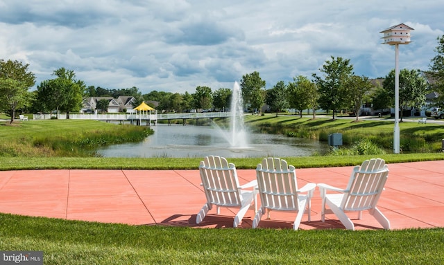 view of patio with a water view