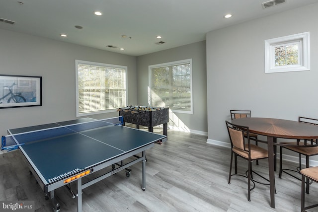 recreation room with light hardwood / wood-style flooring and a healthy amount of sunlight