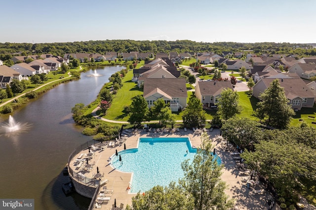 view of pool featuring a water view