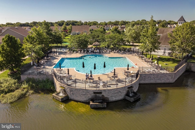 view of pool with a water view