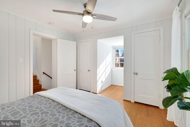 bedroom featuring ceiling fan and light wood-type flooring