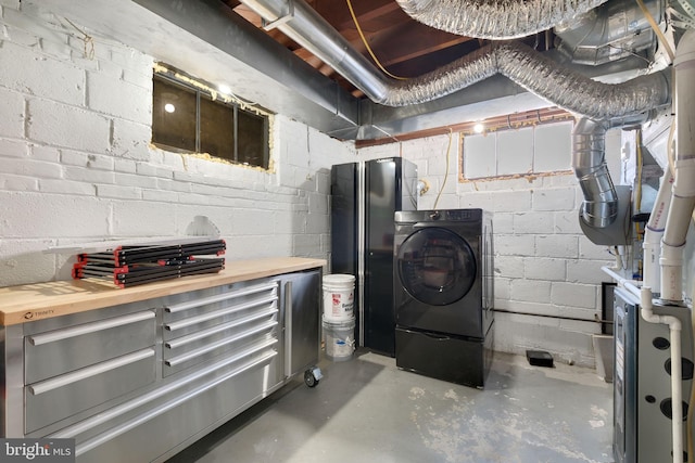 clothes washing area featuring washer / dryer