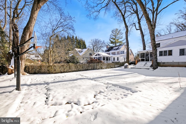 view of yard layered in snow