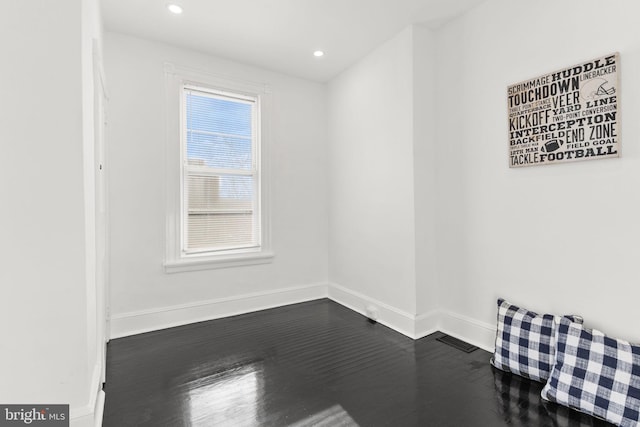 empty room featuring hardwood / wood-style flooring