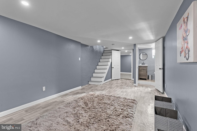 basement featuring light hardwood / wood-style floors