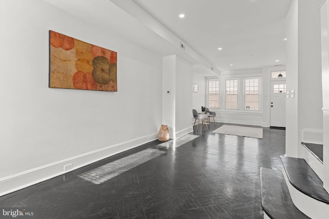 entrance foyer with dark parquet floors