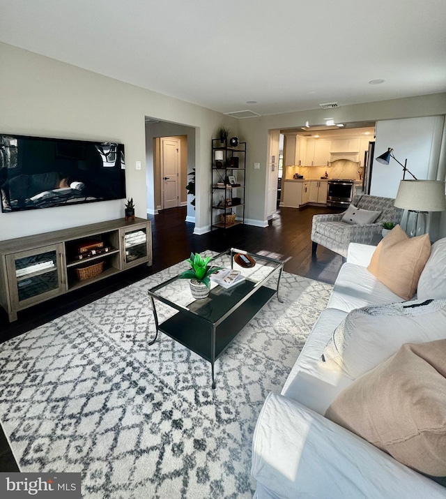 living room with dark wood-type flooring