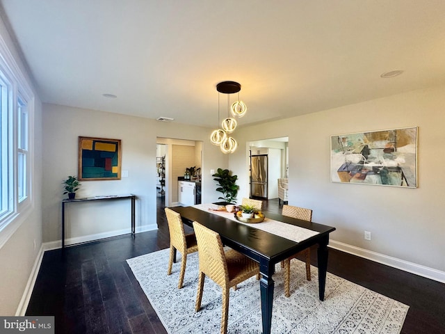 dining area with dark wood-type flooring