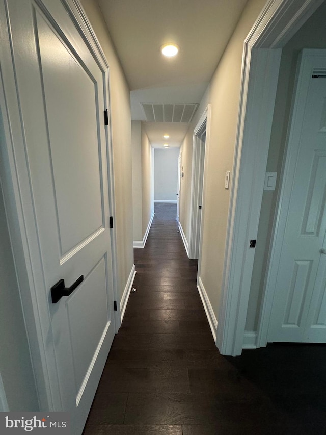 corridor with dark wood-type flooring