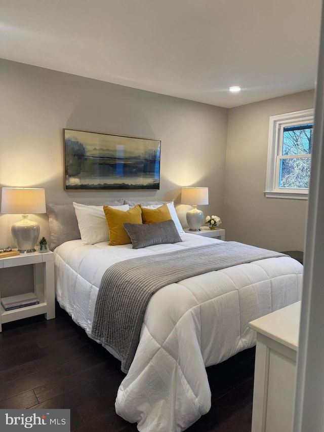 bedroom featuring dark hardwood / wood-style flooring