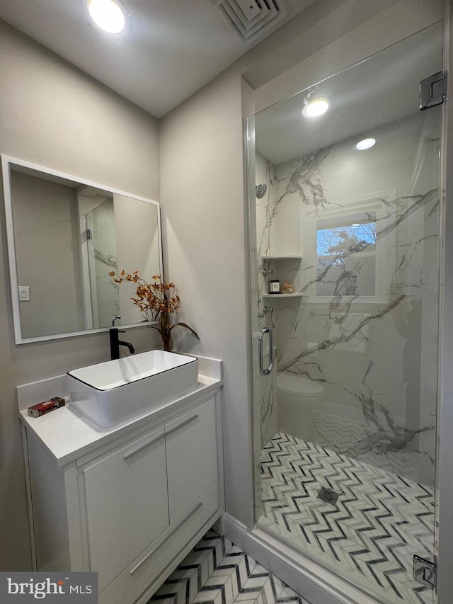 bathroom with vanity and walk in shower