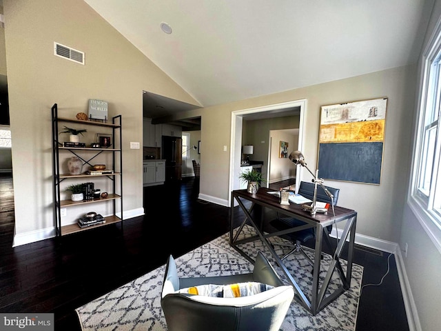 office space with dark hardwood / wood-style floors, plenty of natural light, and high vaulted ceiling