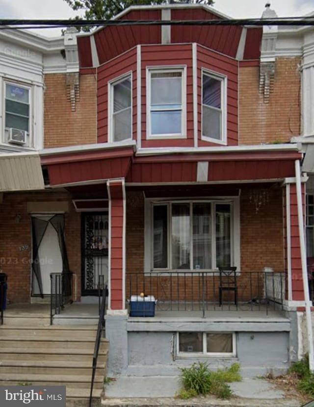 view of property with covered porch