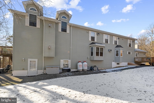 rear view of house featuring a deck