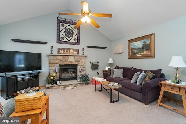 carpeted living room featuring a stone fireplace, ceiling fan, and lofted ceiling