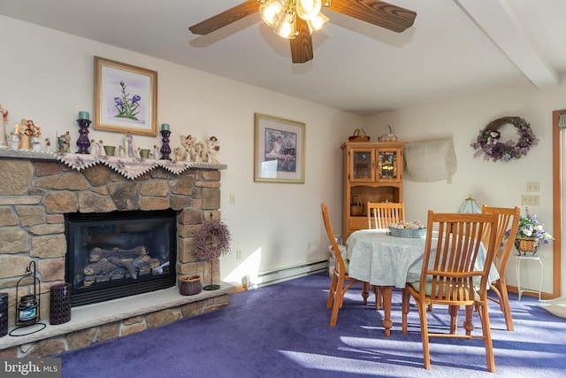 dining area with a stone fireplace, ceiling fan, baseboard heating, beamed ceiling, and carpet floors