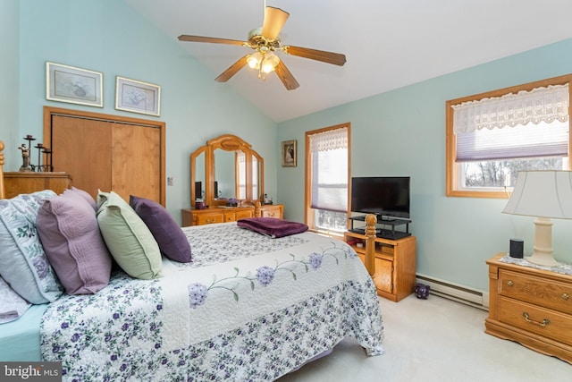 bedroom featuring baseboard heating, ceiling fan, light colored carpet, and vaulted ceiling